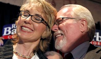 Former Rep. Gabrielle Giffords and Democratic congressional candidate Ron Barber celebrate Mr. Barber&#39;s victory in a special election on Tuesday, June 12, 2012, in Tucson, Ariz., to fill the vacant House seat that Mrs. Giffords held. (AP Photo/Ross D. Franklin, Pool)