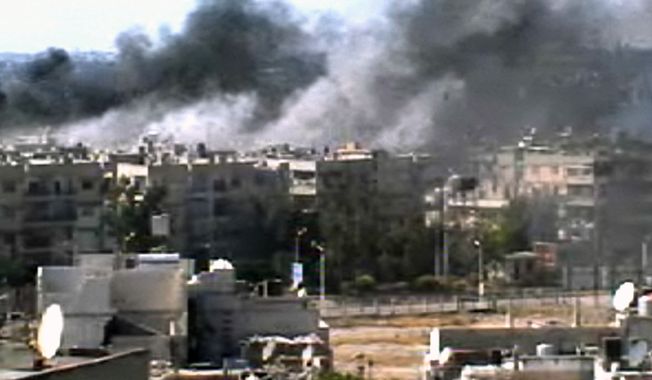 This image taken from amateur video and broadcast by Bambuser/Homslive shows a series of devastating explosions rocking the central Syrian city of Homs on Monday, June 11, 2012. Live streaming video caught the devastation during one of the heaviest examples of violence since the uprisings began over a year ago. (Photo/Bambuser/Homslive via AP Video)