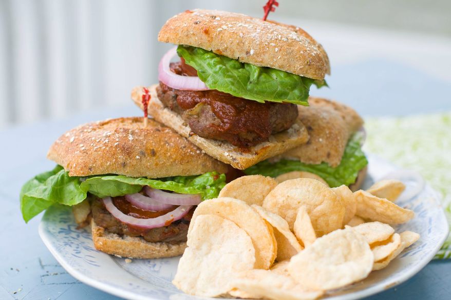 Healthy caramelized onions add moisture and flavor to lean beef. Topped with a delicious homemade barbecue sauce, these grilled burgers will be a real Father's Day treat that is healthy to boot. (Associated Press)