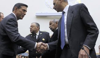 **FILE** House Judiciary Committee member Rep. Darryl Issa (left), California Republican, shakes hands Dec. 8, 2011, with Attorney General Eric Holder on Capitol Hill in Washington. (Associated Press)