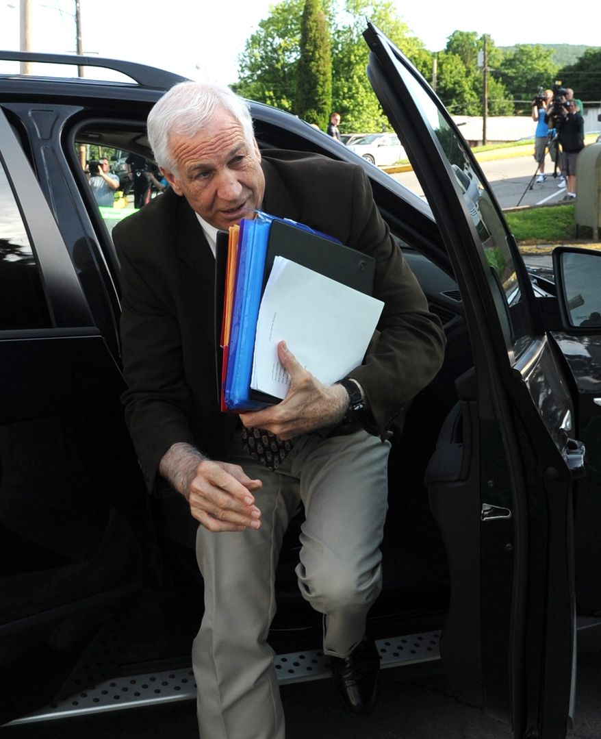 Former Penn State University assistant football coach Jerry Sandusky arrives June 14, 2012, for the fourth day his trial at the Centre County Courthouse in Bellefonte, Pa. Sandusky faces 52 counts of child sex-abuse involving 10 boys over a 15-year span. (Associated Press/Centre Daily Times)