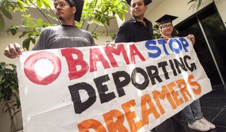 From left: Students David Buenrostro, Adrian James, and Jahel Ramos protest June 14, 2012, outside the Obama campaign offices in Culver City, Calif. The students demand that President Obama issue an executive order to stop deportations of illegal immigrant students in favor of the DREAM Act (Development, Relief, and Education for Alien Minors). In July 2011, California Gov. Brown enacted the California DREAM Act, giving illegal immigrant students access to private college scholarships for state schools. (Associated Press) **FILE**