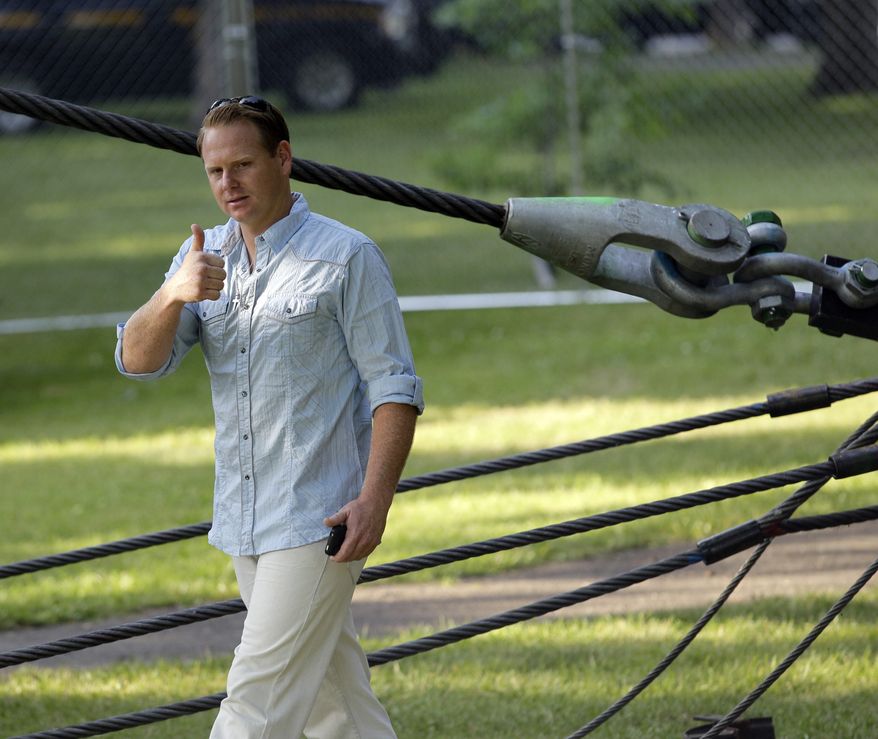 Nik Wallenda greets fans after inspecting the wire prior to his walk across Niagara Falls in Niagara Falls, N.Y., Friday, June 15, 2012. Wallenda will attempt what nobody has done before: A high wire walk directly over the precipice at Niagara Falls and 190 feet (58 meters) above the churning torrent below. (AP Photo/David Duprey)