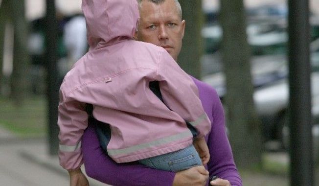 In this June 2009 photo, Drasius Kedys is shown with daughter Deimante Kedys in Lithuania. Kedys claimed his daughter was being abused by a pedophile ring involving the girl&#x27;s mother and including judges and politicians he claimed preyed on his daughter, who was 5 at the time. He was found dead under mysterious circumstances less than a year later. (Associated Press)