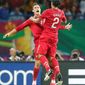 Cristiano Ronaldo ( left) and Bruno Alves celebrate Portugal&#39;s second goal during their Euro 2012 Group B match against the Netherlands in Kharkiv, Ukraine. (Associated Press)