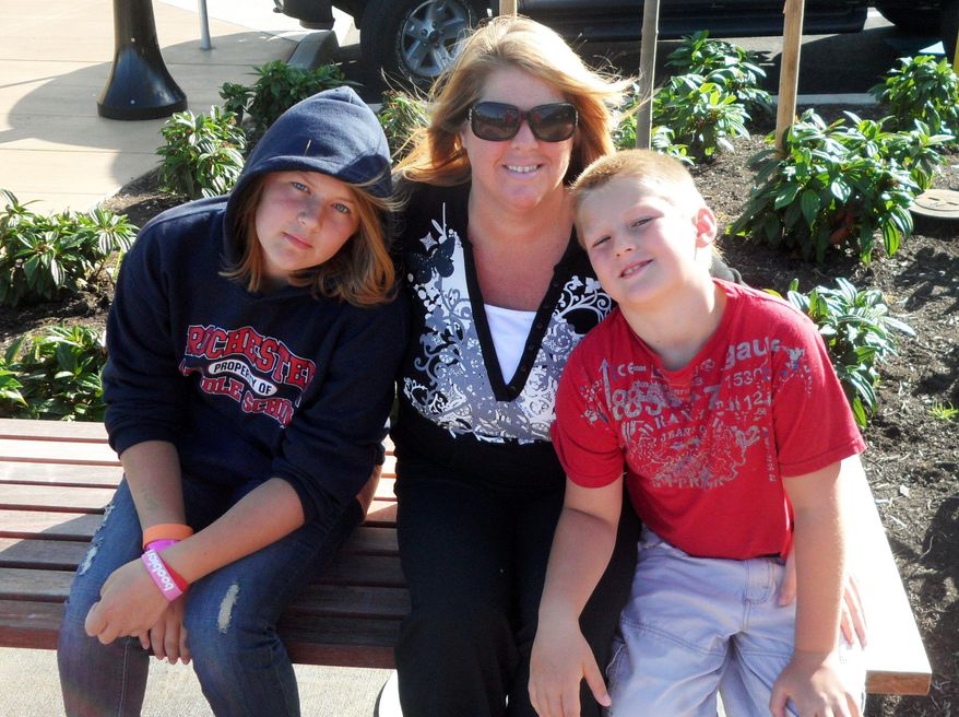 Sarena Haskins, seen with her children, Hannah and Hayden, is a regular user of marijuana for medical purposes. Many states have moved to allow medical marijuana or decriminalize its use. (Associated Press)