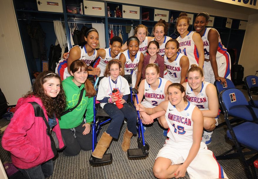 Kayla Wenger and the American women's basketball team bonded through the Friends of Jaclyn Foundation, an organization that matches children with brain tumors with college athletic teams. Kayla was the Eagles' ultimate good-luck charm; they never lost when she was at their games. (Photo provided by AUEagles.com)