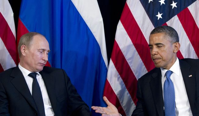 President Obama holds out his hand to shake Russian President Vladimir Putin&#x27;s during a bilateral meeting at the G-20 summit on Monday, June 18, 2012, in Los Cabos, Mexico. (Associated Press)