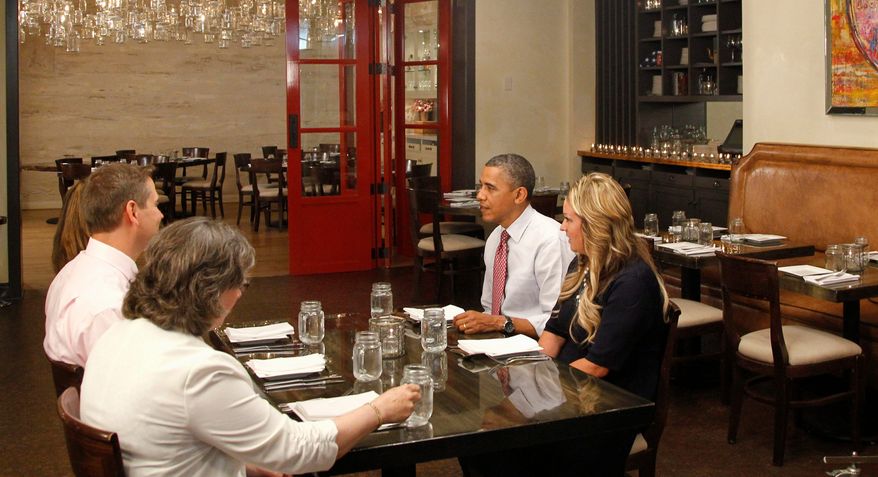 President Obama eats lunch with winners of "Lunch with Barack," at the Lincoln Restaurant in Washington last week. Rewards for loyalty to a campaign can be as simple as a T-shirt or as special as preferential seating at a rally. "I would call this the swag factor," said Chas Mastin, who worked on a way to track supporter activity. (Associated Press)