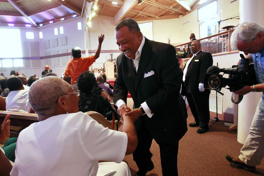 The Rev. Fred Luter Jr., pastor of the Franklin Avenue Baptist Church in New Orleans, greets the congregation during services on Sunday, June 3, 2012. (AP Photo/Gerald Herbert)