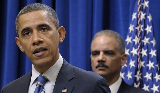 **FILE** President Obama (left) speaks Feb. 9, 2012, in Washington about a settlement with the nation&#x27;s five largest banks over foreclosures. Attorney General Eric H. Holder Jr. is in the background. (Associated Press)