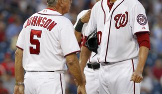 Washington Nationals manager Davey Johnson comes to the pitcher&#x27;s mound to pull starting pitcher Chien-Ming Wang during the fourth inning against the Tampa Bay Rays at Nationals Park on Tuesday, June 19, 2012 in Washington. The Rays won 5-4. (AP Photo/Alex Brandon)
