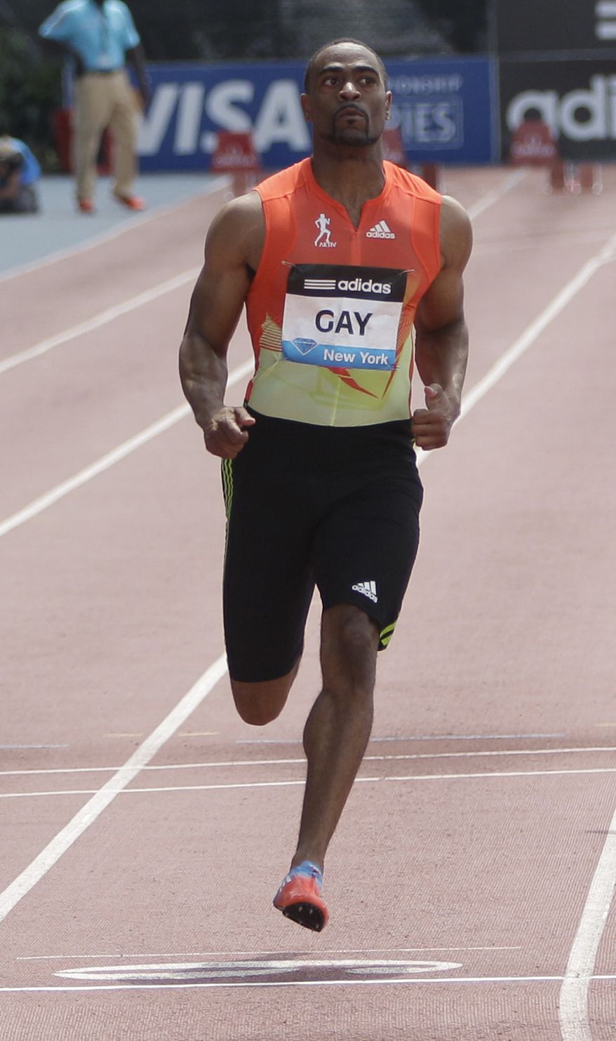Tyson Gay crosses the finish line ahead of the pack during the 100-meter B race at the Adidas Grand Prix track and field meet on Randall's Island, Saturday, June 9, 2012, in New York. (AP Photo/Mary Altaffer)
