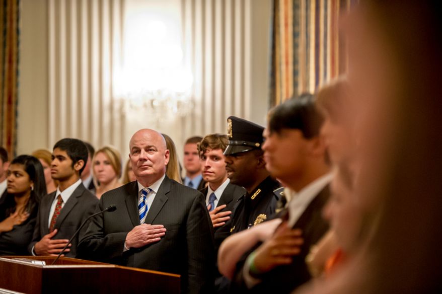 Thomas P. McDevitt, President of the Washington Times Newspaper, third from left, acts as the Master of Ceremonies as youth are awarded the Congressional Award Gold Medal during an award ceremony in the Cannon House Office Building on Capitol Hill, Washington, D.C., Wednesday, June 20, 2012. The 276 youth honored this year in the annual award ceremony for completing 400 hours of Voluntary Public Service activities, 200 hours each of Personal Development and Physical Fitness activities, as well as an Expedition and Exploration activity were greeted by members of congress as well as Verdine White and Ralph Johnson, two members of Earth, Wind, and Fire. (Andrew Harnik/The Washington Times)