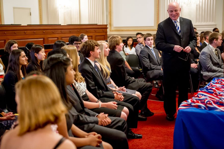 Thomas P. McDevitt, President of the Washington Times Newspaper, second from right, acts as the Master of Ceremonies as youth are awarded the Congressional Award Gold Medal during an award ceremony in the Cannon House Office Building on Capitol Hill, Washington, D.C., Wednesday, June 20, 2012. The 276 youth honored this year in the annual award ceremony for completing 400 hours of Voluntary Public Service activities, 200 hours each of Personal Development and Physical Fitness activities, as well as an Expedition and Exploration activity were greeted by members of congress as well as Verdine White and Ralph Johnson, two members of Earth, Wind, and Fire. (Andrew Harnik/The Washington Times)