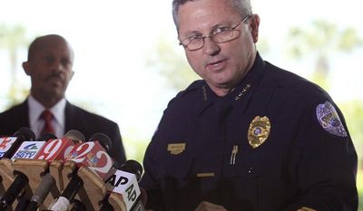 ** FILE ** Sanford, Fla., police Chief Bill Lee speaks to the the media about the Trayvon Martin case as Sanford City Manager Norton N. Bonaparte Jr. (left) looks on, on Thursday, March 22, 2012, in Sanford, Fla. (AP Photo/Julie Fletcher)