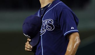 Tampa Bay Rays reliever Joel Peralta reacts as he comes off the field after pitching during the eighth inning against the Washington Nationals on Wednesday, June 20, 2012, in Washington. The Nationals won 3-2. (AP Photo/Alex Brandon)
