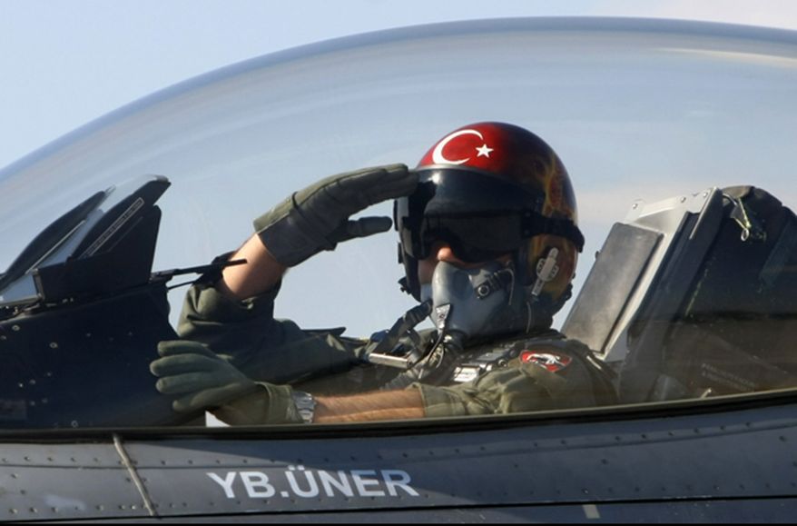 ** FILE ** In this April 29, 2010, file photo, a Turkish pilot salutes before take-off at an air base in Konya, Turkey. Turkish President Abdullah Gul said Saturday, June 23, 2012, his country would take "necessary" action against Syria for the downing of a Turkish military jet, but suggested that the aircraft may have unintentionally violated the Syrian airspace. The plane went down in the Mediterranean Sea about 8 miles (13 kilometers) away from the Syrian town of Latakia, Turkey, said. (AP Photo/File)