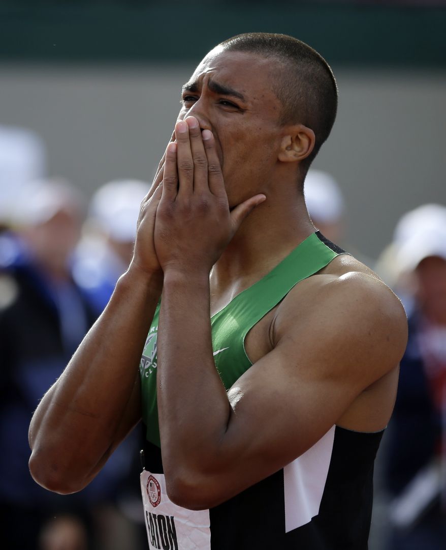 Ashton Eaton reacts after the 1500m during the decathlon competition at the U.S. Olympic Track and Field Trials Saturday, June 23, 2012, in Eugene, Ore. Eaton finished the decathlon with a new world record. (AP Photo/Matt Slocum)
