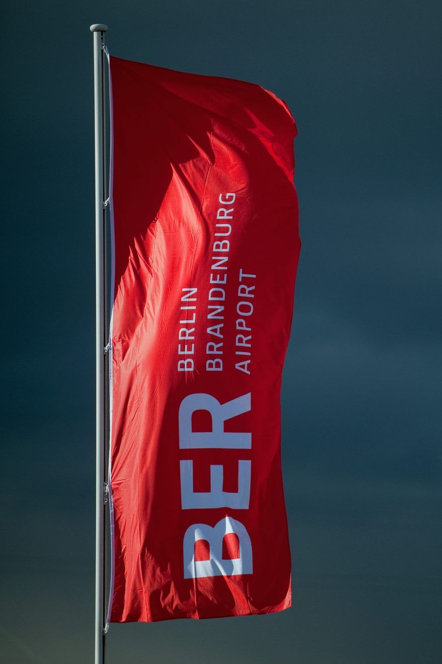 The flag is flying but planes aren't at the new Berlin airport. Lawsuits await, and so, perhaps, does a criminal investigation into what happened at the $3.2 billion facility. (Associated Press)
