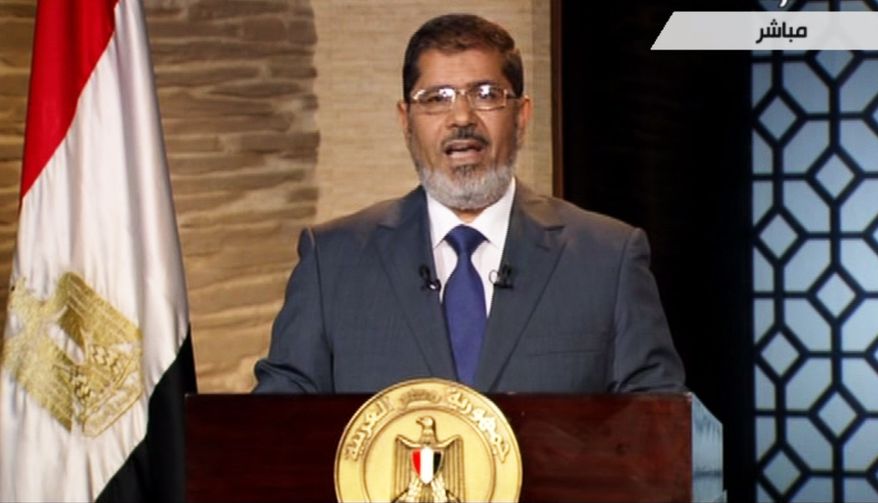 Egyptian President-elect Mohammed Morsi speaks in Cairo on Sunday, June 24, 2012, in this image taken from Egypt State TV. (AP Photo/Egypt State TV)