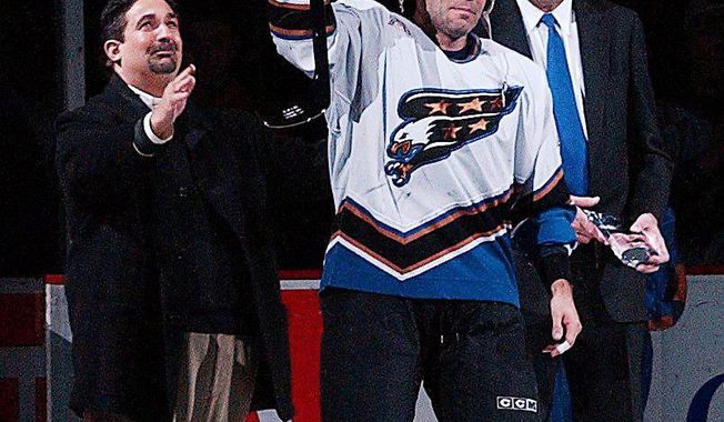 Adam Oates was named the Capitals&#x27; coach despite never having served as a head coach at any level. He did, however, construct a Hall of Fame playing career by scoring 341 goals and amassing 1,079 assists in 19 seasons. Below, as a member of the Capitals, he was honored for playing in his 1,000th NHL game. (Associated Press)