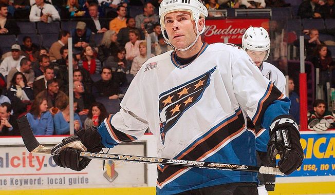 ** FILE ** Washington Capitals center Adam Oates skates into position for a faceoff against the Minnesota Wild at the MCI Center in Washington in 2002. (The Washington Times)