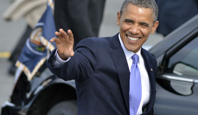President Obama waves to supporters June 25, 2012, after arriving on Air Force One at Logan International Airport in Boston. (Associated Press)