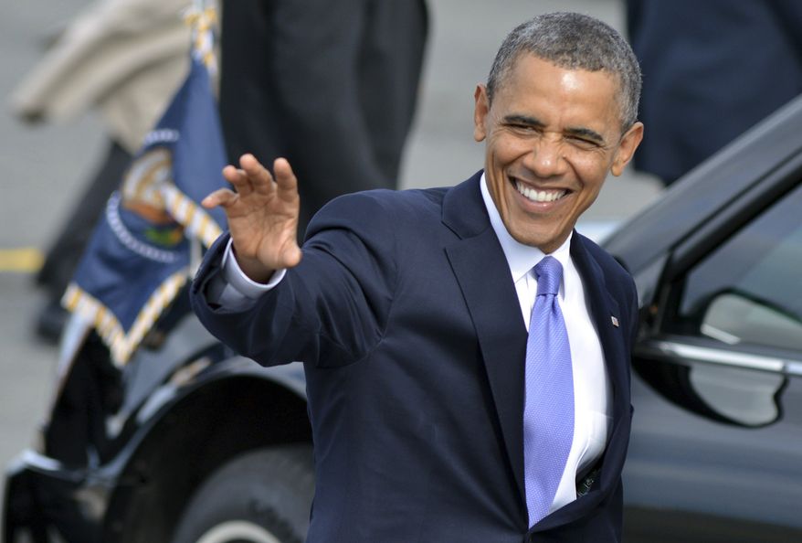 President Obama waves to supporters June 25, 2012, after arriving on Air Force One at Logan International Airport in Boston. (Associated Press)