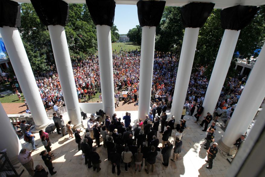 University of Virginia president Teresa Sullivan, center, at podium, addresses a crowd of supporters outside the university Rotunda after she was reinstated by the Board of Visitors during a meeting at the school Tuesday, June 26, 2012 in Charlottesville, Va. The 15-member Board of Visitors voted unanimously to reinstate Sullivan less than three weeks after ousting her in a secretive move that infuriated students and faculty, had the governor threatening to fire the entire governing board and sparked a debate about the most effective way to operate public universities in an era of tight finances. Shortly after the vote, Sullivan thanked the board members for their renewed confidence in her. (AP Photo/Steve Helber)