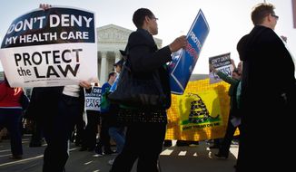 Protesters on both sides of the Affordable Care Act were out in force March 26 at the Supreme Court when justices heard arguments on President Obama&#39;s health care law. On Thursday, the justices will deliver their opinion. (Andrew Harnik/The Washington Times)