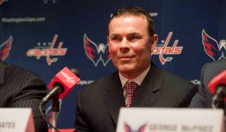 Washington Capitals CEO Dick Patrick, Founder and Chairmen Ted Leonsis , and Vice President and General Manager George McPhee, introduce new head coach Adam Oates during a press conference at Verizon Center on Wednesday, June 27, 2012, in Washington D.C. (Raymond Thompson/The Washington TImes)