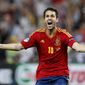 Spain&#39;s Cesc Fabregas celebrates after scoring the decisive penalty shootout during the Euro 2012 semifinal match between Spain and Portugal in Donetsk, Ukraine, on Thursday, June 28, 2012. (AP Photo/Jon Super)