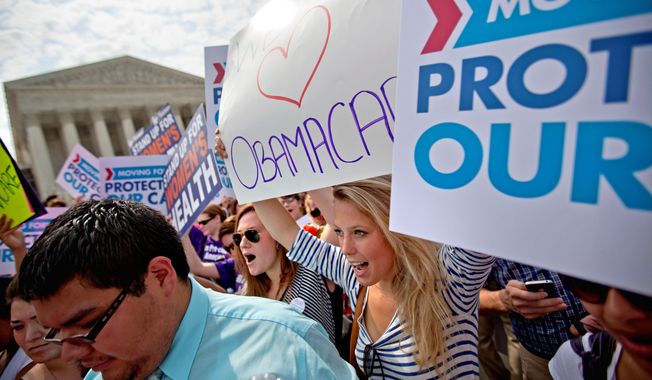 **FILE** Supporters of President Obama&#x27;s health care law celebrate June 28, 2012, outside the Supreme Court after the court&#x27;s ruling was announced. A narrow 5-4 majority led by Chief Justice G. Roberts Jr. upheld the controversial 2010 law. (Associated Press)