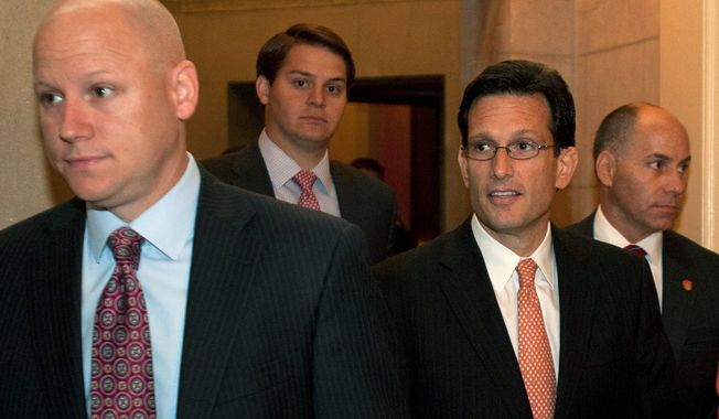 Surrounded by staff members, House Majority Leader Eric Cantor (center), Virginia Republican, leaves House Speaker John Boehner&#x27;s office on Capitol Hill in Washington on June 28, 2012, after the Supreme Court&#x27;s ruling on President Obama&#x27;s health care law. (Associated Press)