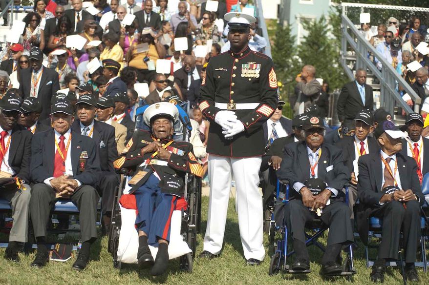 Four hundred and forty retired Marines received the Congressional Gold Medal for their military service during the Montford Pointe Marines Parade at the Marine Barracks Washington on Thursday, June 28, 2012, in Washington D.C. Approximately 20,000 African American Marine recruits where trained at Montford Pointe when the military was still segregated. (Raymond Thompson/The Washington Times)