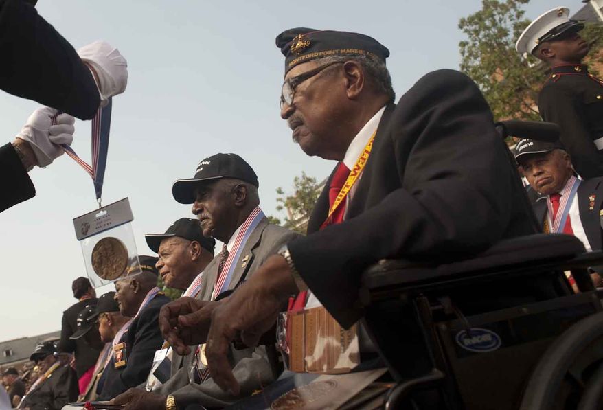 Archbald Mosley (cq), from Florida, waits for his medal to be hung around his neck during the Montford Pointe Marines Parade at the Marine Barracks Washington on Thursday, June 28, 2012, in Washington D.C. Approximately 20,000 African American Marine recruits where trained at Montford Pointe when the military was still segregated. (Raymond Thompson/The Washington Times)