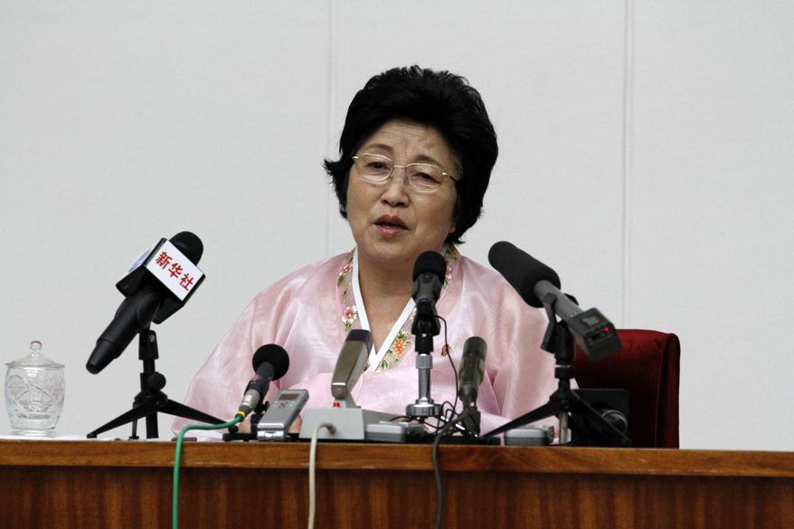 North Korean Pak Jong-suk speaks to reporters at the People’s Palace of Culture in Pyongyang, North Korea, on Thursday, June 28, 2012. Ms. Pak said she was tricked into defecting to South Korea by agents who offered to arrange a reunion with her long-lost father, but she returned home after being disillusioned with life in the South. (AP Photo/Kim Kwang-hyon)