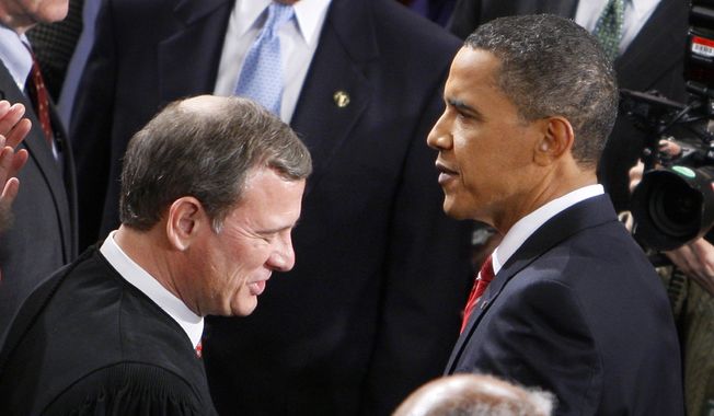 President Obama greets Chief Justice John Roberts on Jan. 27, 2010, before he delivered his State of the Union Address on Capitol Hill in Washington. (Associated Press) **FILE** 