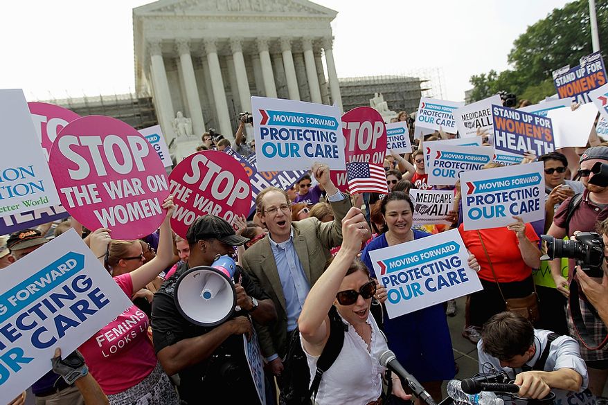 Supporters of President Barack Obama&#39;s health care law celebrate outside the Supreme Court in Washington, Thursday, June 28, 2012, after the court&#39;s ruling. AP Photo/David Goldman)