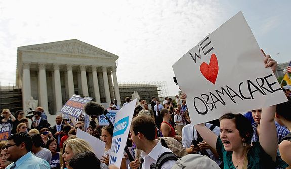 Supporters of President Obama&#39;s health care law celebrate outside the Supreme Court in Washington on June 28, 2012, after the court&#39;s ruling was announced. (Associated Press)