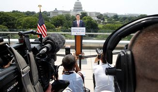 With the Capitol in the background, Republican presidential candidate, former Massachusetts Gov. Mitt Romney speaks about the Supreme Court&#39;s health care ruling, Thursday, June 28, 2012, in Washington. (AP Photo/Charles Dharapak)
