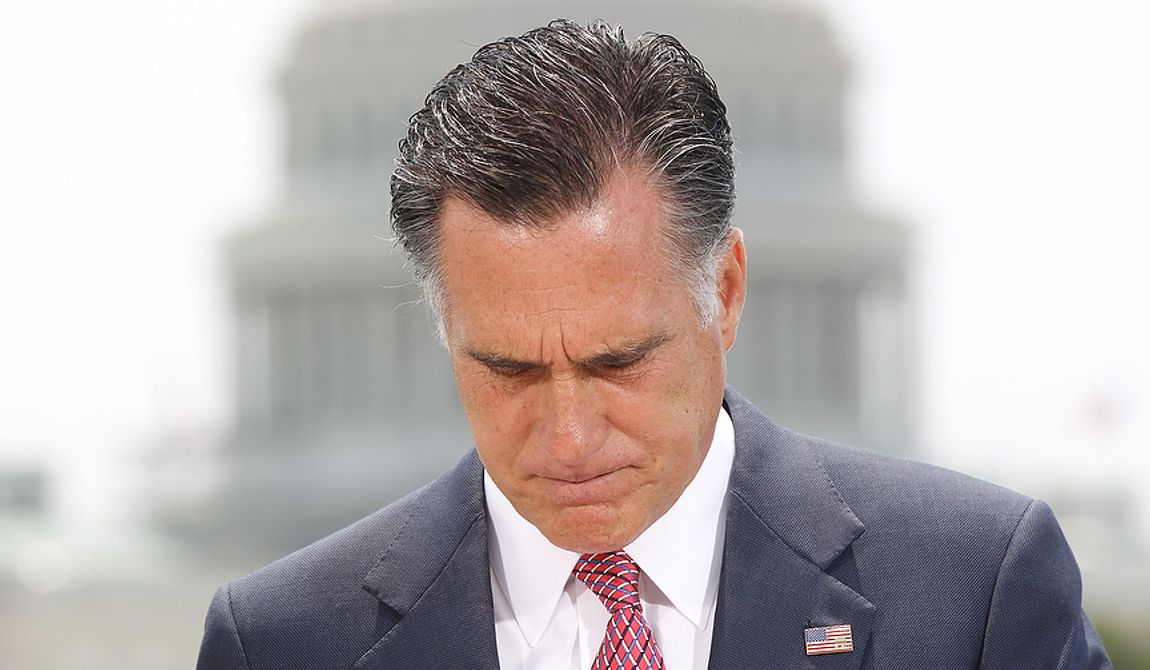 With the Capitol in the background, Republican presidential candidate, former Massachusetts Gov. Mitt Romney pauses while speaking about the Supreme Court&#x27;s health care ruling, Thursday, June 28, 2012, in Washington. (AP Photo/Charles Dharapak)