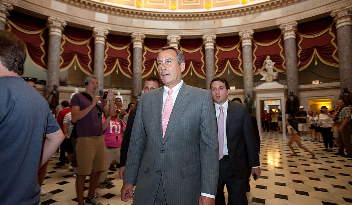 House Speaker John A. Boehner (center), Ohio Republican, walks toward the House chamber on Capitol Hill in Washington on Thursday, June 28, 2012, after the Supreme Court&#x27;s ruling on President Obama&#x27;s health care law. (AP Photo/Jacquelyn Martin)