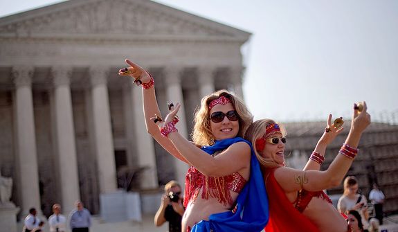 Belly dancers Angela Petry, left, and Jennifer Carpenter-Peak, both of Washington, dance outside the Supreme Court in Washington,Thursday, June 28, 2012, in Washington, as part of a demonstration as the Supreme Court is expected to rule on President Barack Obama&#39;s health care law. (AP Photo/David Goldman)