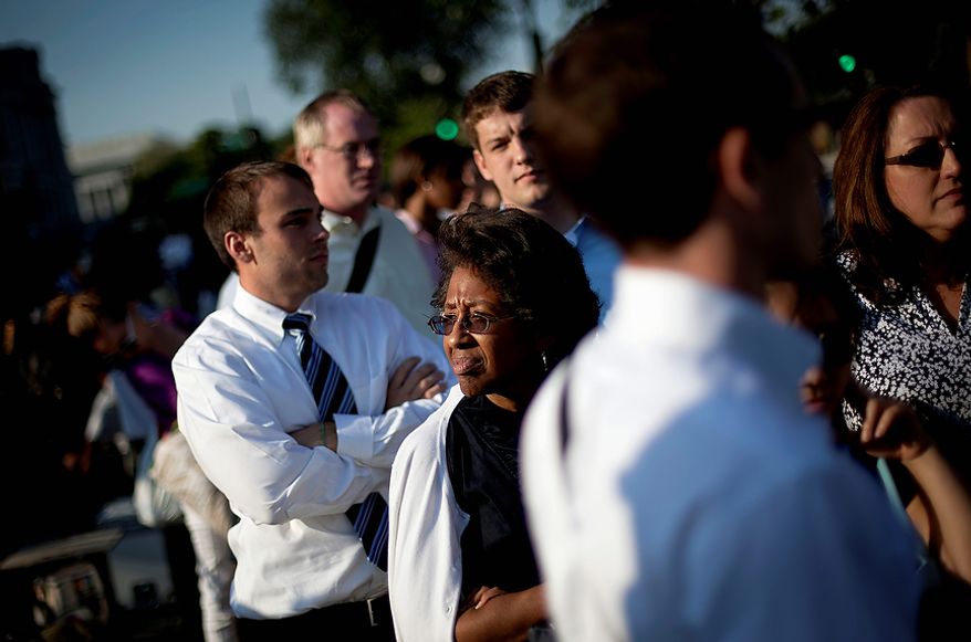 Joy Wilson of Washington, waits in line hoping for a pass to enter  the Supreme Court in Washington, Thursday, June 28, 2012. Saving its biggest case for last, the Supreme Court is expected to announce its verdict Thursday on President Barack Obama&#39;s health care law. (AP Photo/David Goldman)