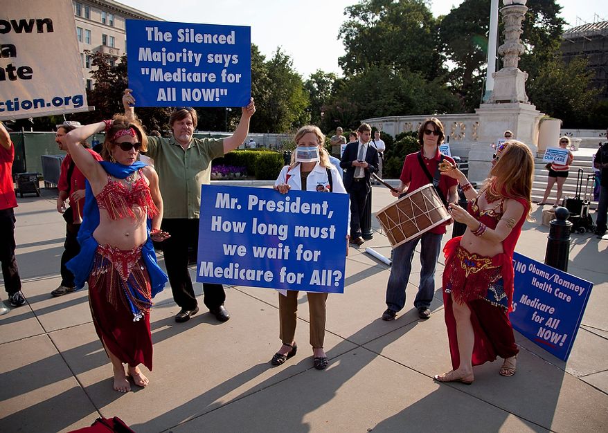 A group of belly dancers in favor of Medicare for all perform outside the Supreme Court in Washington, Thursday, June 28, 2012, before a landmark decision on health care.  (AP Photo/Evan Vucci)
