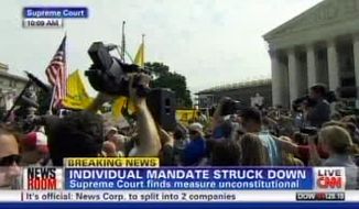 This television frame grab shows CNN broadcasting the Supreme Court&#x27;s decision incorrectly on President Barack Obama&#x27;s health care law on Thursday, June 28, 2012. Both CNN and Fox News Channel incorrectly reported Thursday that the law&#x27;s central provision, requiring virtually all Americans to have health insurance, had been struck down. Both networks backtracked when it became clear that the court upheld the provision. (AP Photo)