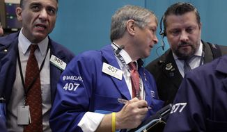 Traders work on the floor of the New York Stock Exchange on June 28, 2012. (Associated Press)