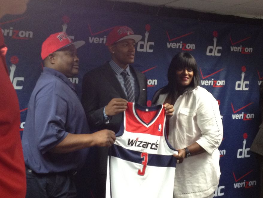 Bradley Beal, the Washington Wizards' No. 3 pick in Thursday's draft, stands for photos with his parents. (Nicolas Nightingale/The Washington Times)